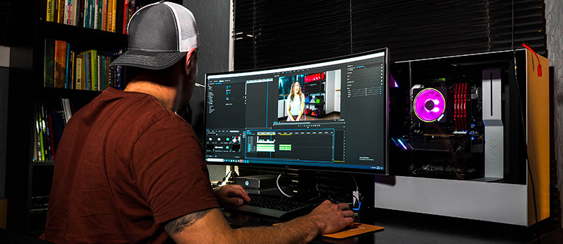 Man editing at a workstation for audio video production 