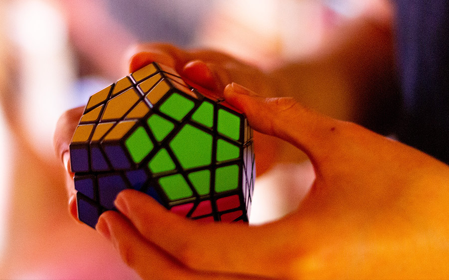 A person solving a Rubik cube
